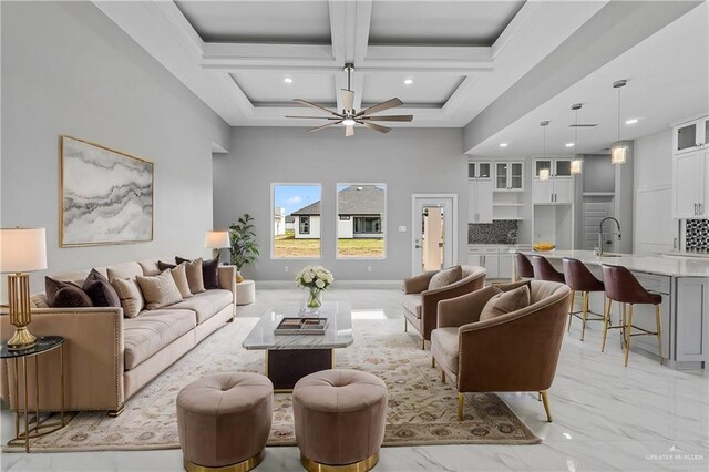 519 Oriole Dr, Los Fresnos, TX 78566 - living area with beamed ceiling, marble finish floor, coffered ceiling, and ceiling fan