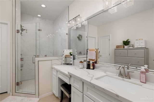 bathroom featuring vanity and an enclosed shower