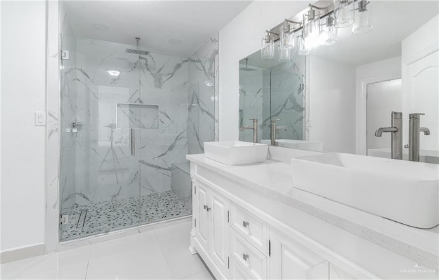 bathroom featuring vanity, tile patterned floors, and a shower with door