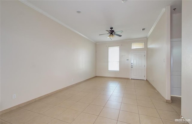 tiled foyer entrance with crown molding and ceiling fan