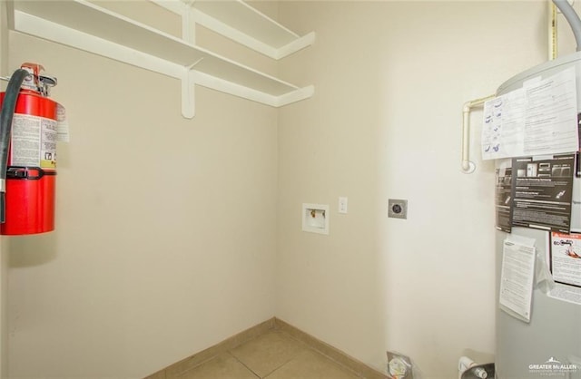 laundry area featuring hookup for a washing machine, tile patterned floors, and hookup for an electric dryer