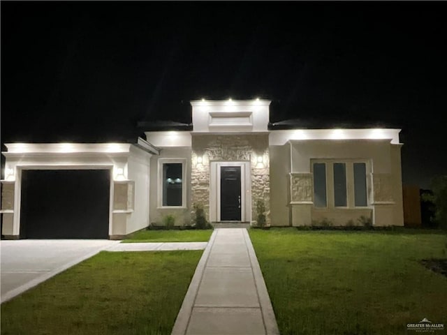prairie-style home featuring driveway, an attached garage, stucco siding, and a lawn