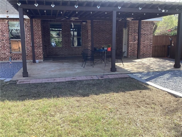 view of patio featuring ceiling fan