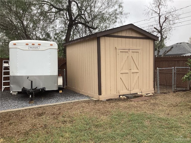 view of outbuilding with a lawn