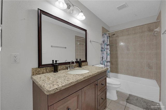 full bathroom with tile patterned floors, shower / tub combo with curtain, vanity, and toilet