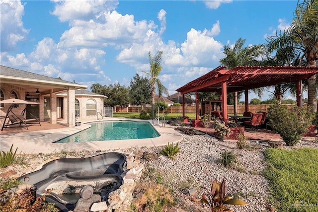 view of pool featuring a pergola, ceiling fan, and a patio