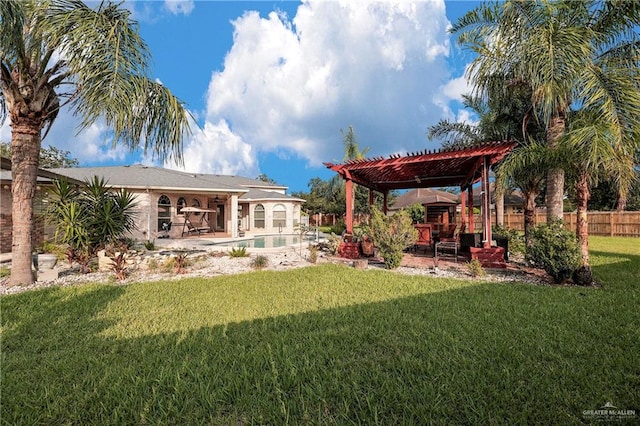 view of yard featuring a patio area, a fenced in pool, and a pergola