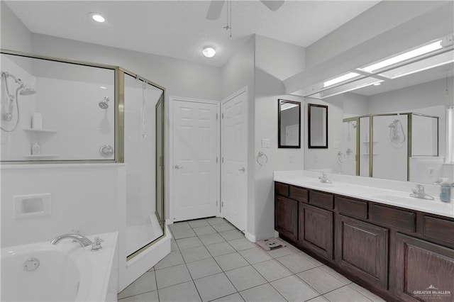 bathroom featuring shower with separate bathtub, vanity, tile patterned floors, and ceiling fan