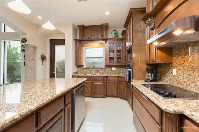 kitchen with backsplash, hanging light fixtures, range hood, plenty of natural light, and stainless steel appliances