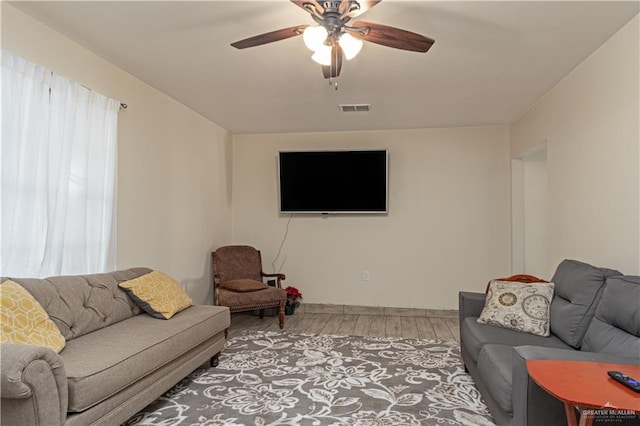 1309 El Camino Dr, Weslaco, TX 78599 - living area with light wood-type flooring and ceiling fan