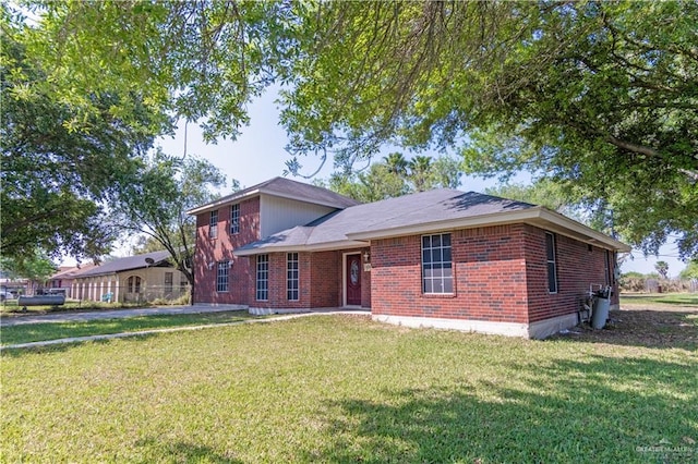 1309 El Camino Dr, Weslaco, TX 78599 - view of front of house with brick siding and a front lawn