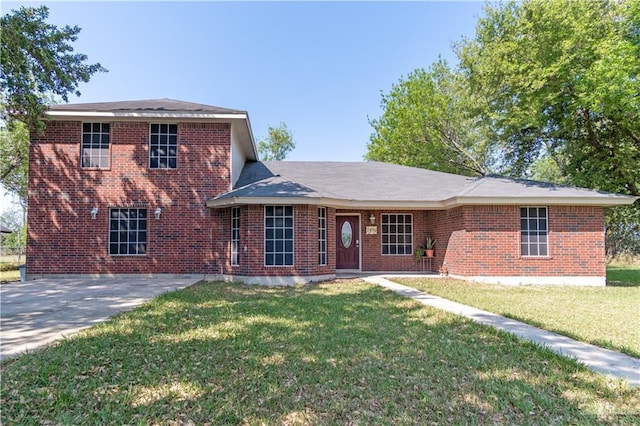 1309 El Camino Dr, Weslaco, TX 78599 - view of front of house with brick siding and a front lawn