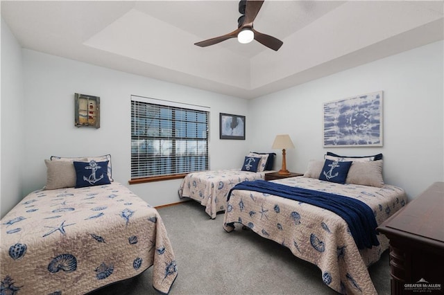 130 E Gardenia St, South Padre Island, TX 78597 - bedroom featuring carpet floors, ceiling fan, and a tray ceiling