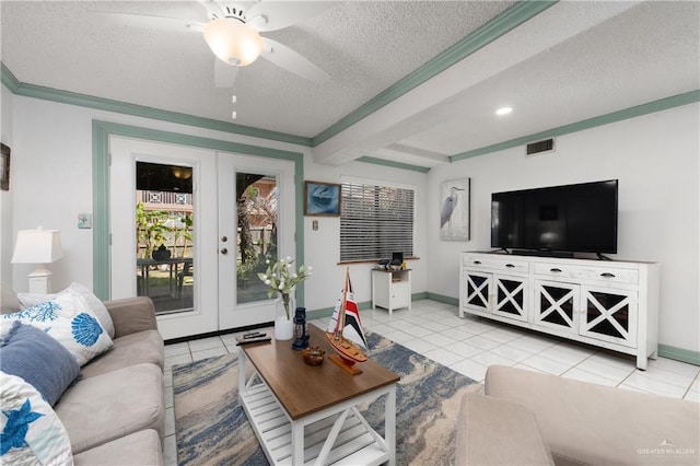 130 E Gardenia St, South Padre Island, TX 78597 - living room with light tile patterned floors, baseboards, visible vents, a textured ceiling, and french doors