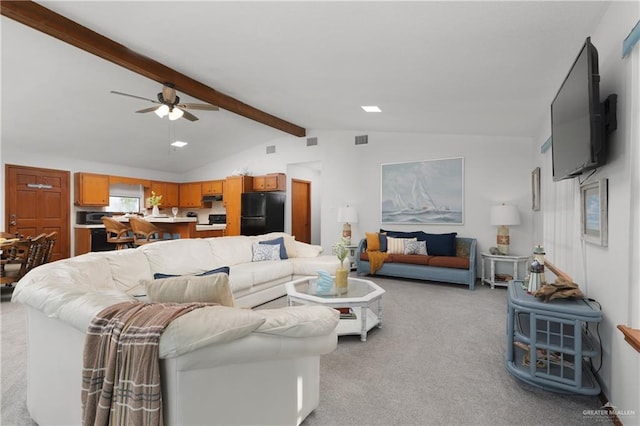 130 E Gardenia St, South Padre Island, TX 78597 - living room with light carpet, lofted ceiling with beams, a ceiling fan, and visible vents
