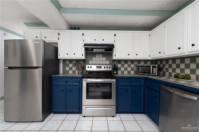 130 E Gardenia St, South Padre Island, TX 78597 - kitchen featuring a textured ceiling, under cabinet range hood, white cabinetry, stainless steel appliances, and blue cabinetry