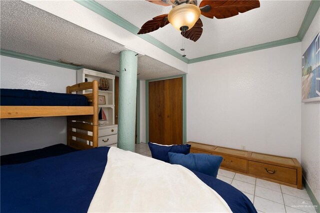 130 E Gardenia St, South Padre Island, TX 78597 - bedroom with a textured ceiling, ceiling fan, and ornamental molding