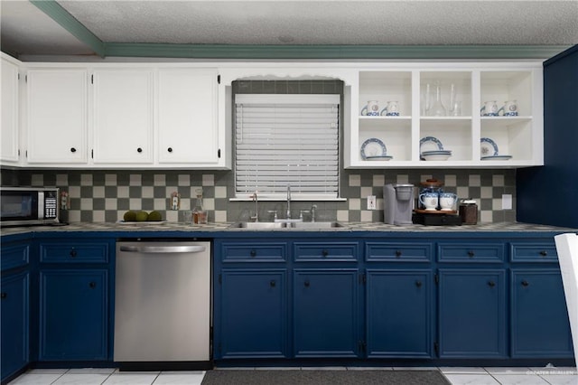 130 E Gardenia St, South Padre Island, TX 78597 - kitchen with a sink, open shelves, dark countertops, appliances with stainless steel finishes, and blue cabinets