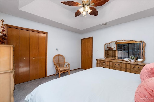 130 E Gardenia St, South Padre Island, TX 78597 - carpeted bedroom featuring visible vents, ceiling fan, a raised ceiling, and a closet