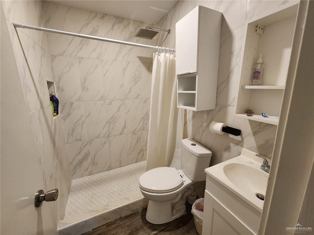 bathroom with vanity, toilet, tile walls, curtained shower, and wood-type flooring