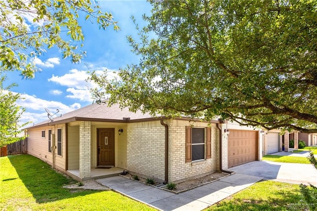 125 Katie Ct, Boerne, TX 78006 - ranch-style house with concrete driveway, brick siding, and an attached garage