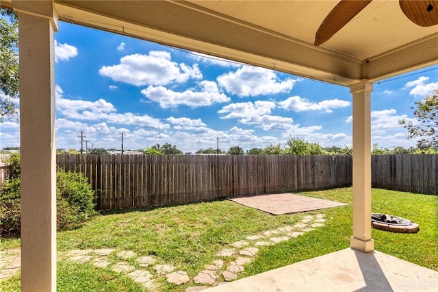125 Katie Ct, Boerne, TX 78006 - fenced backyard featuring a patio area and a fire pit