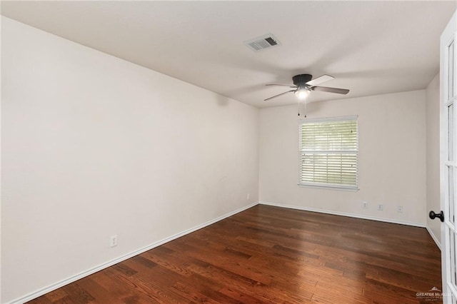 empty room featuring ceiling fan and dark hardwood / wood-style floors