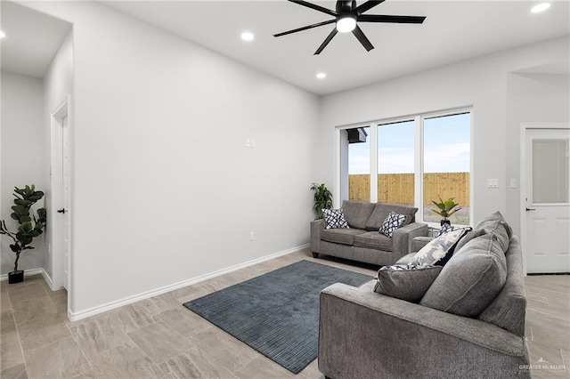 living room with recessed lighting, baseboards, and ceiling fan