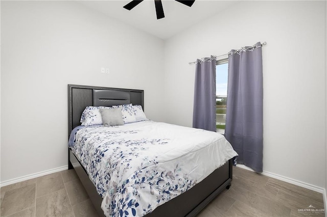 bedroom with baseboards and ceiling fan