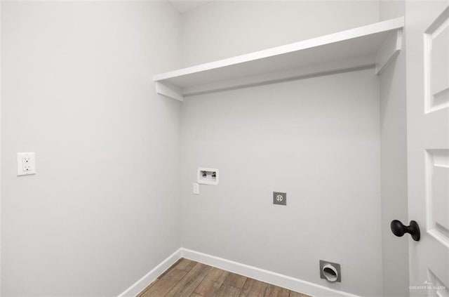 814 Gomez St, San Juan, TX 78589 - laundry area featuring electric dryer hookup, hookup for a washing machine, baseboards, and wood finished floors