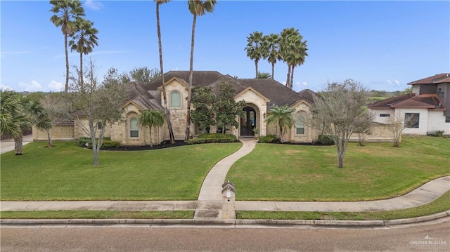 mediterranean / spanish-style home featuring a front lawn