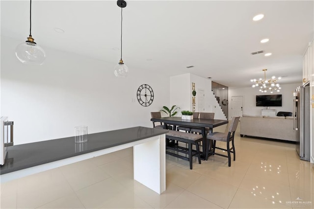 dining room featuring light tile patterned floors, stairs, recessed lighting, and a chandelier