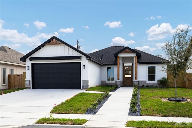 view of front of house with a front lawn and a garage