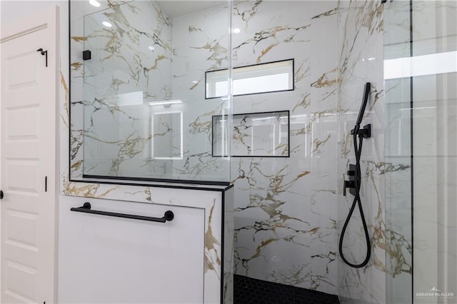 bathroom with a marble finish shower