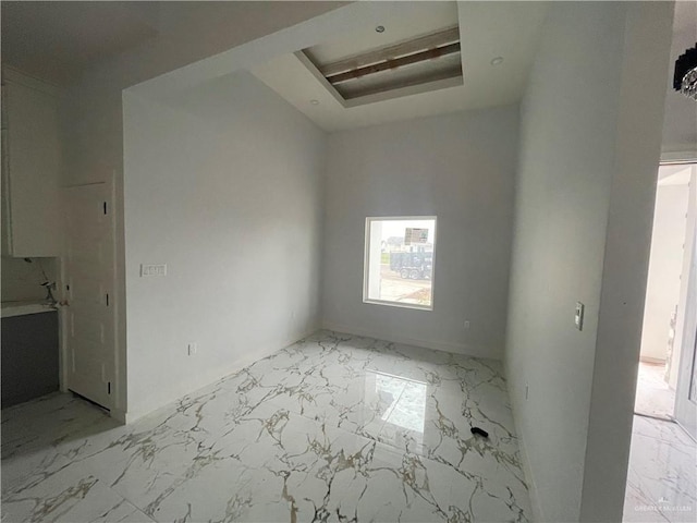 interior space featuring marble finish floor