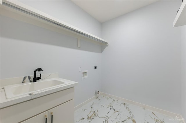 washroom with baseboards, hookup for a washing machine, marble finish floor, hookup for an electric dryer, and a sink