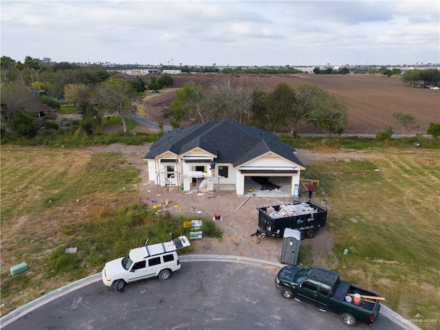 birds eye view of property featuring a rural view