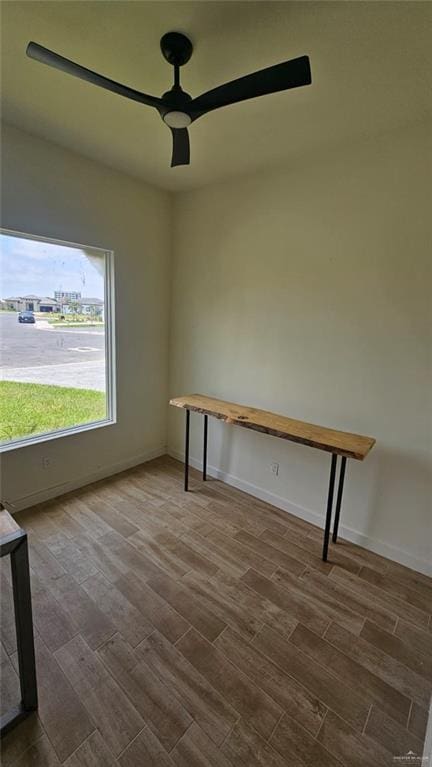 2721 Chesterfield Ave, Edinburg, TX 78539 - spare room with dark wood-style floors, a ceiling fan, and baseboards