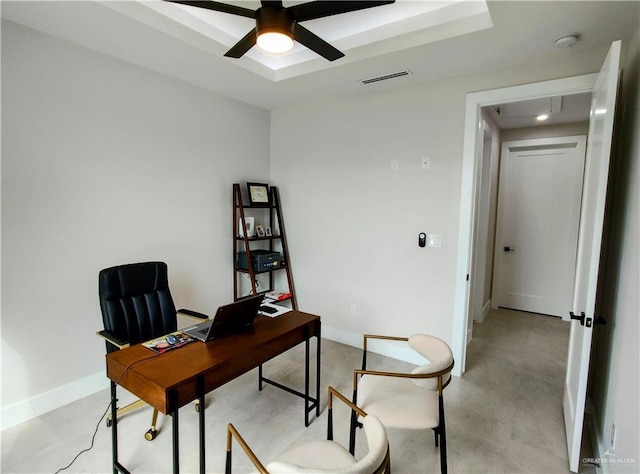 office space featuring baseboards, visible vents, concrete flooring, and a ceiling fan