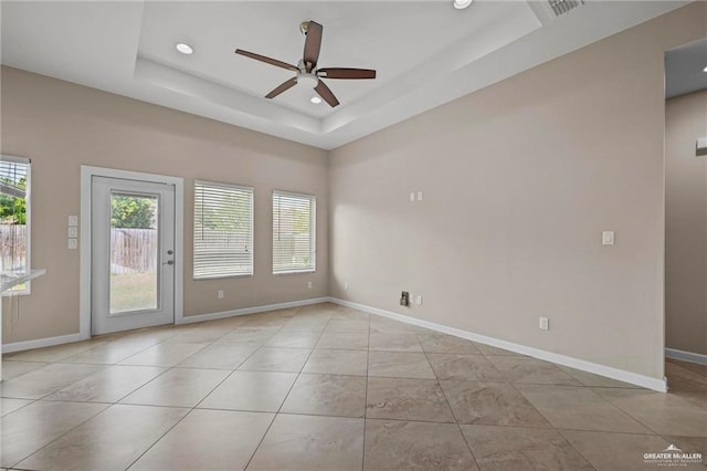 empty room featuring recessed lighting, ceiling fan, and baseboards
