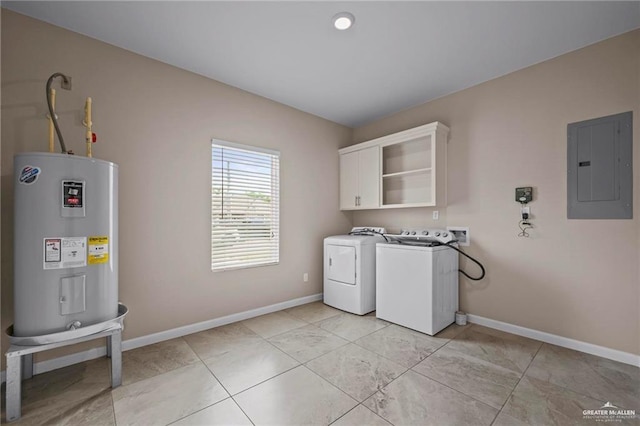 clothes washing area with water heater, independent washer and dryer, cabinet space, electric panel, and baseboards