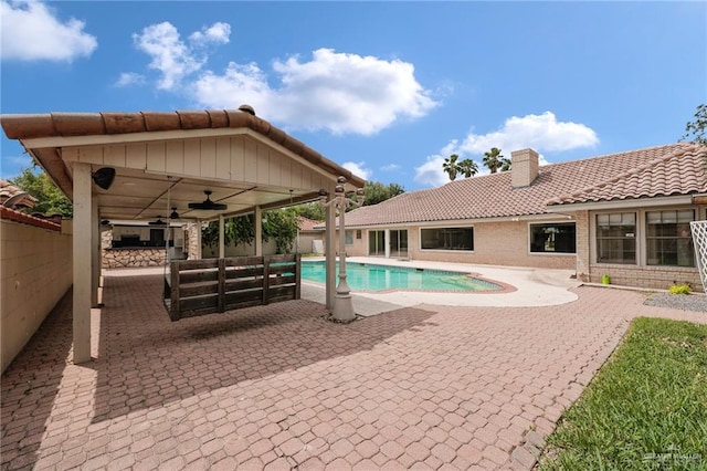view of pool featuring ceiling fan, a fenced in pool, fence, an outdoor hangout area, and a patio