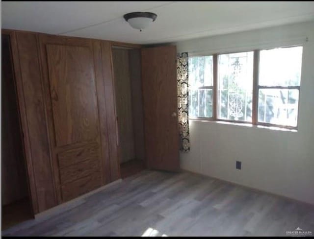 unfurnished bedroom with light hardwood / wood-style floors