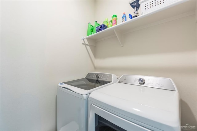 washroom featuring independent washer and dryer