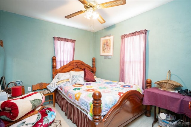 tiled bedroom with ceiling fan