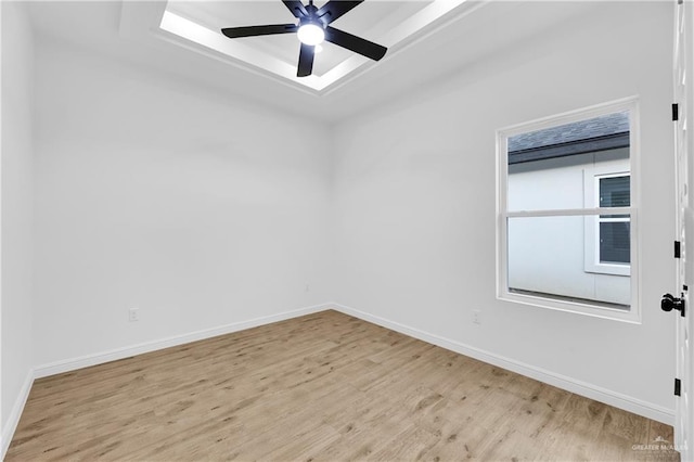 unfurnished room with ceiling fan and light hardwood / wood-style flooring