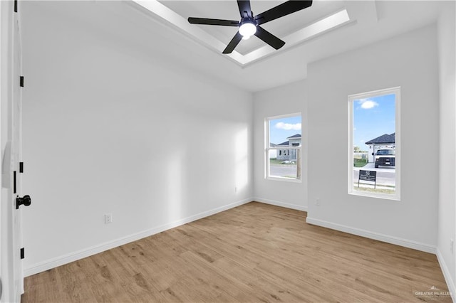 spare room featuring ceiling fan and light wood-type flooring