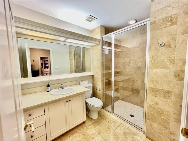 3530 Los Lagos Dr, Edinburg, TX 78542 - bathroom with a shower stall, visible vents, toilet, and vanity