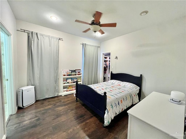 3530 Los Lagos Dr, Edinburg, TX 78542 - bedroom with a ceiling fan and dark wood-type flooring