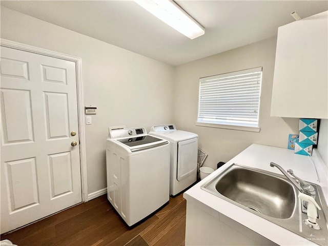 3530 Los Lagos Dr, Edinburg, TX 78542 - laundry area with a sink, cabinet space, dark wood-type flooring, and independent washer and dryer